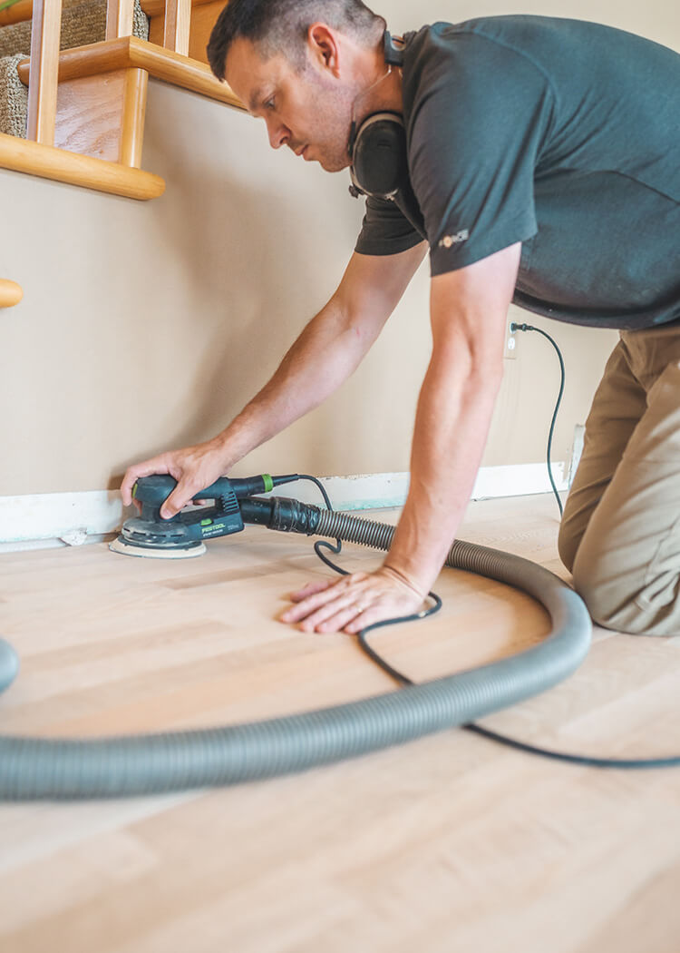 Palm sander being used